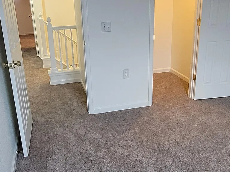 Southeast bedroom looking to hallway and walk-in closet