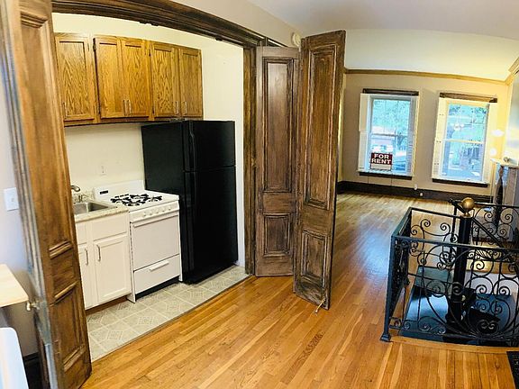Kitchen with French folding doors and dining area