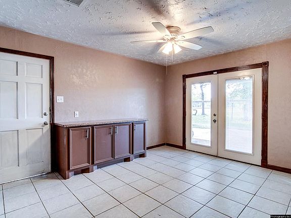 View of the Breakfast Room into the Double French Doors to the Back Yard