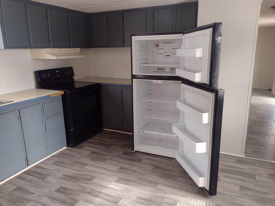 Matching glass top stove and refrigerator.