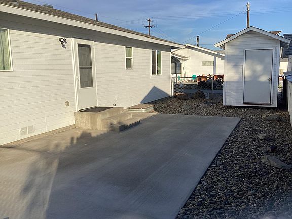 Back patio with storage shed