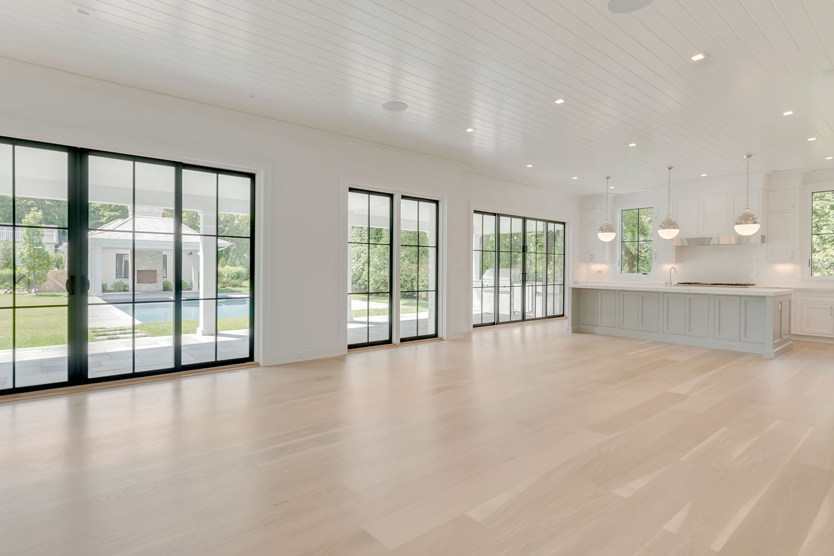 Kitchen/dining/den area opens immediately out to the pool