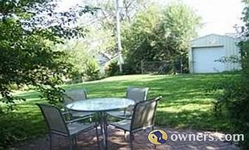 Spacious backyard w/brick patio and shed