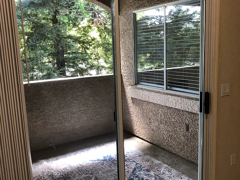 Huge wraparound covered patio overlooking parklike setting.
