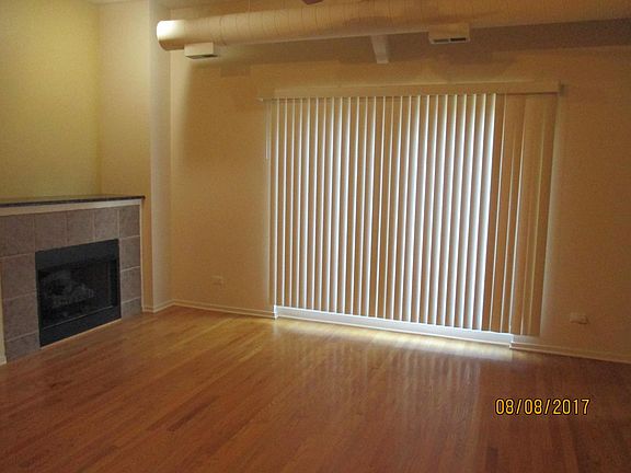 Family room with fireplace and balcony