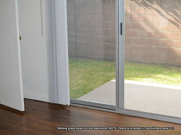 Two Sliding Glass Doors to Back Yard (From Kitchen & Bedroom)
