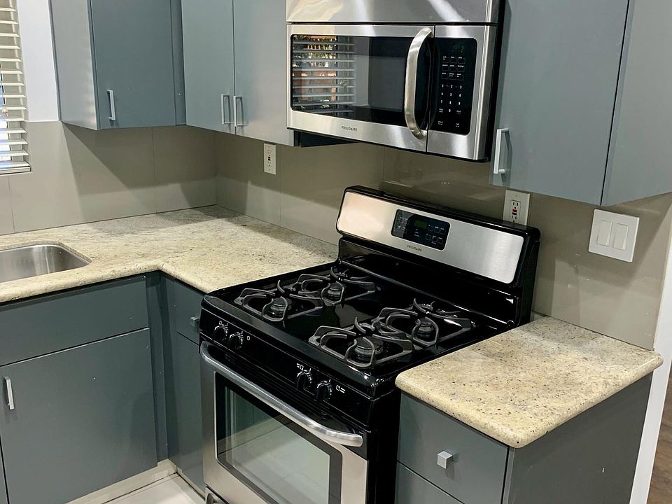 Custom Kitchen with Granite Counters and Stainless Steel Appliances