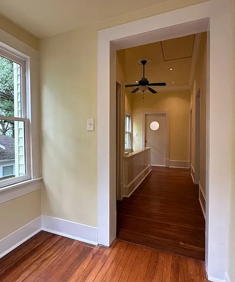 From the luminous Study looking down the hall. You might also call this intimate space a reading nook or sun room.
