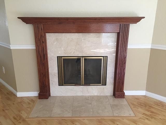 Wood burning fireplace that provides ample heat to front part of condo in fall/ winter.