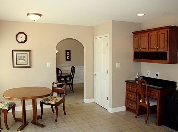 Eat-in kitchen with built-in desk area Beautiful curved doorways