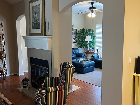 View from the living room into the family room area. Kitchen is off to the right.
