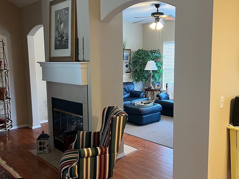 View from the living room into the family room area. Kitchen is off to the right.