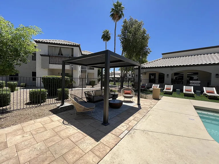 Relax on our patio by the pool, right outside our building