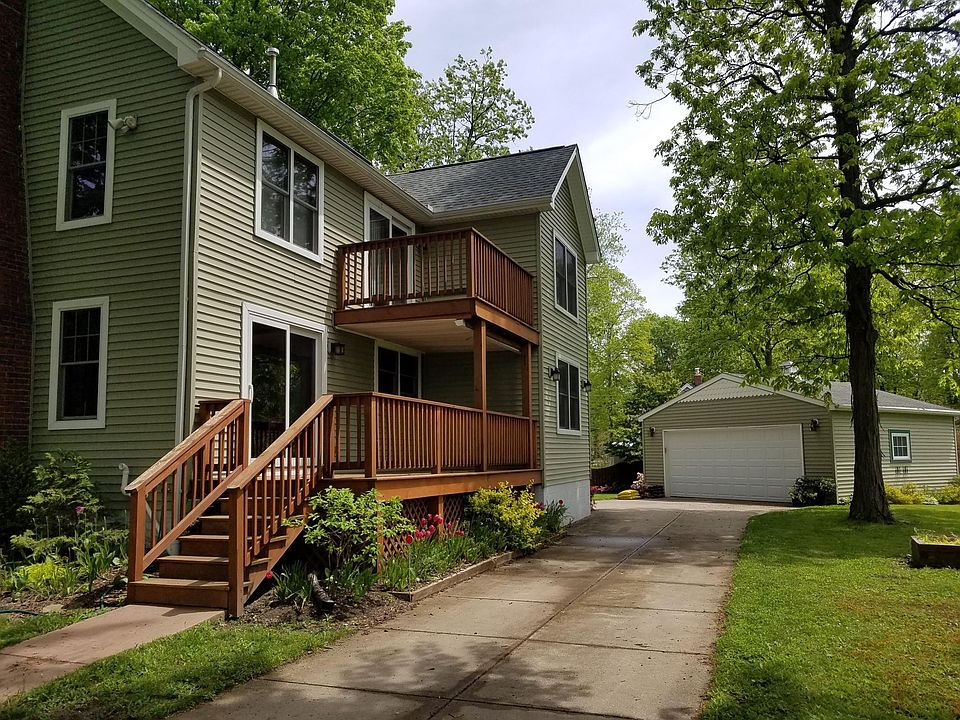 View showing tenant's upstairs apartment, driveway and shared garage