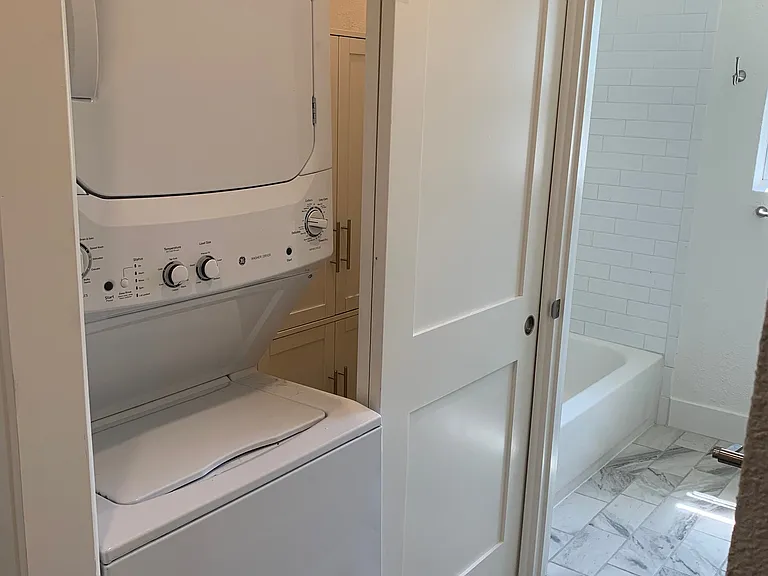 Stacked washer and dryer, storage area