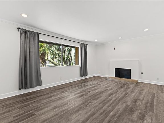 Big living room with upgraded floor and paint