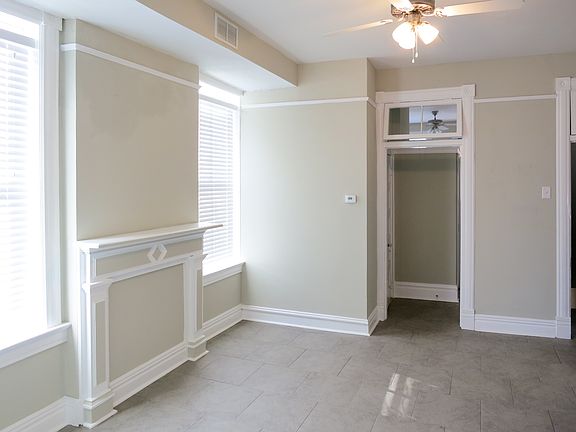 Hall off kitchen leads to bathroom and bedroom