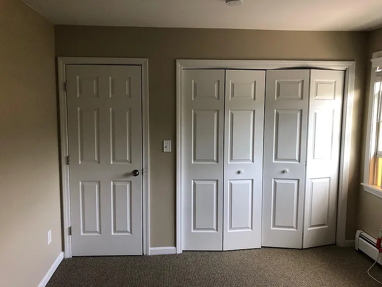 bedroom with custom closet