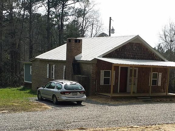 Large graveled area for a firepit and chairs and/or a garden