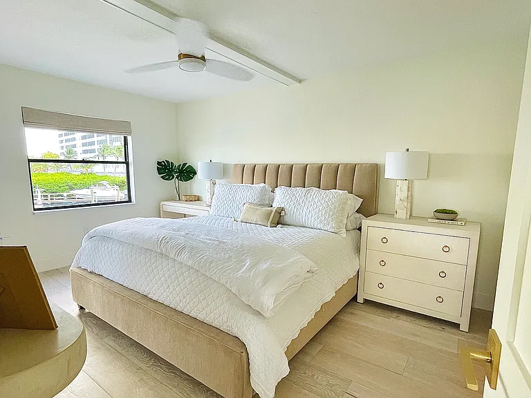 Primary bedroom with blackout shades and king bedroom. Desk that can be moved in front of window overlooking bay - a favorite spot for remote workers and digital nomads