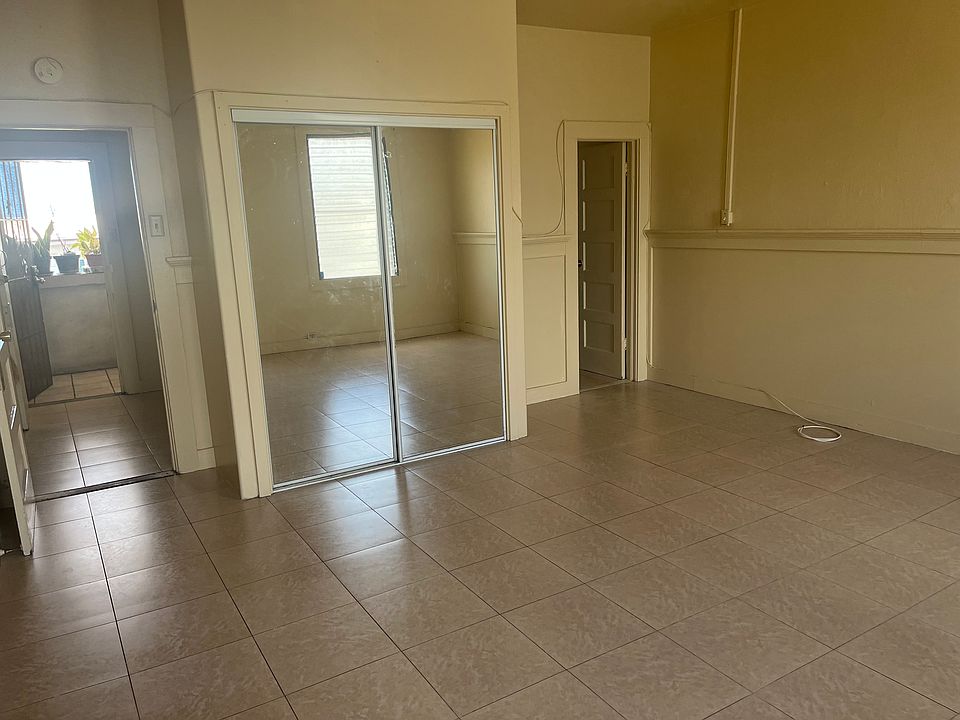 Entry into unit, pass kitchen and into unit with mirrored closet doors