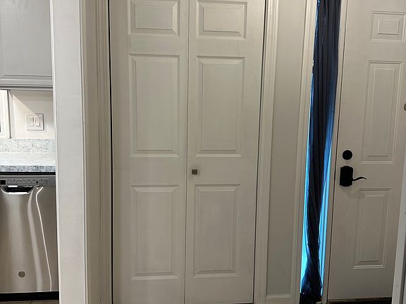 hallway into foyer (pantry door)