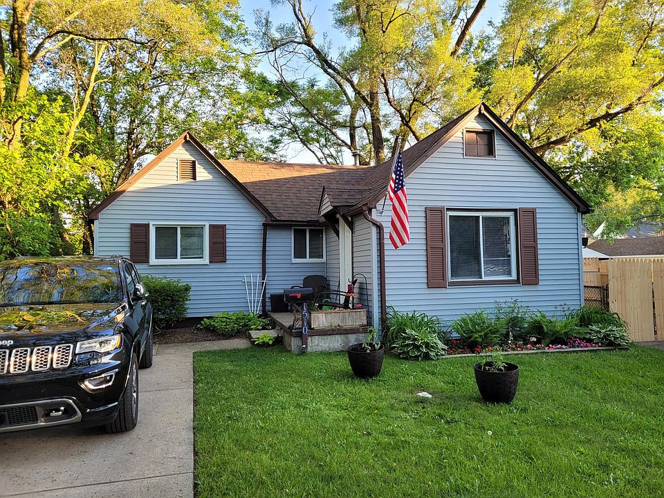 front of house - tucked away from street further than most on this block! Perrenial plants include ferns, hostas, lillies, and ground covering.