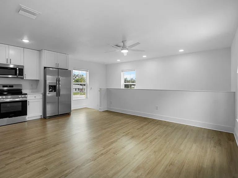 Living room with kitchen access