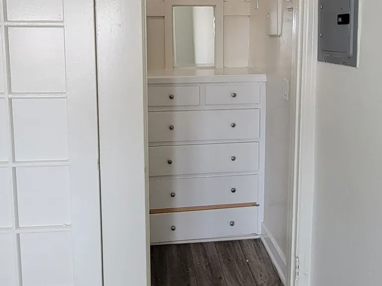 Large closet with built in chest in studio apartment at the Western At Rosewood apartments in Los Angeles, California.