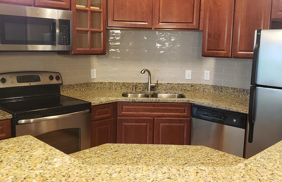 An even closer look into the kitchen and over the coutertop shows the additional working space on the drop down ledge