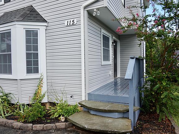 Entrance to front door with custom stone steps.
