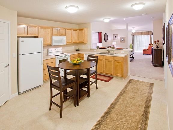 Bright kitchen with room for a table and bar stools, plus lo