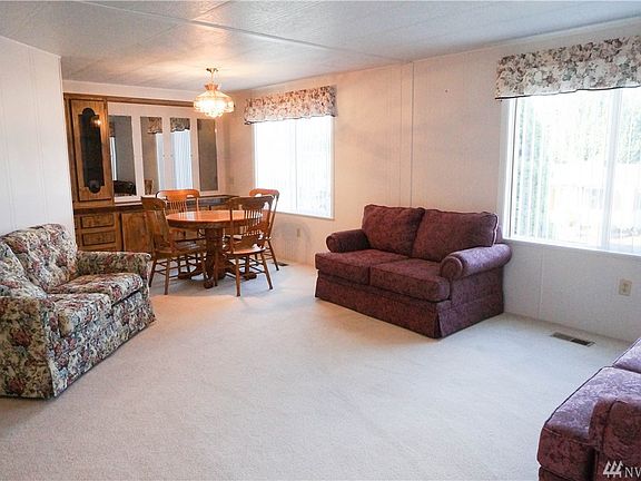 A nice sized living room & a dining room with a built-in china cabinet & side board.