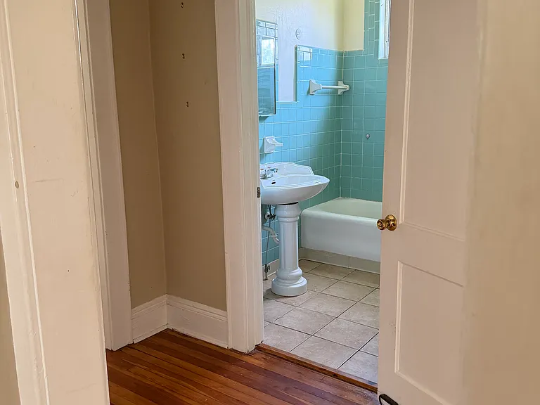 alt bathroom view from dining room showing hallway