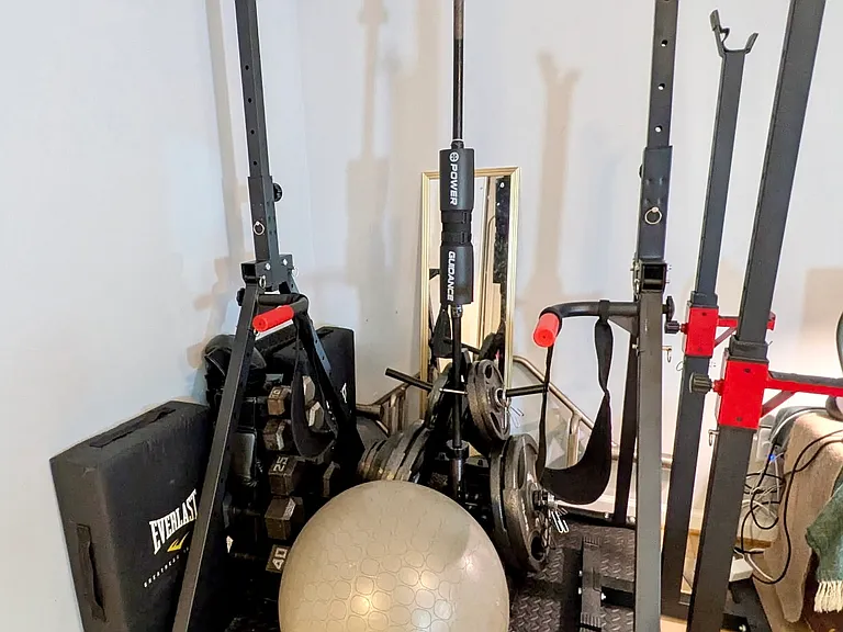 Gym weights and pull-up bar; treadmill also provided.