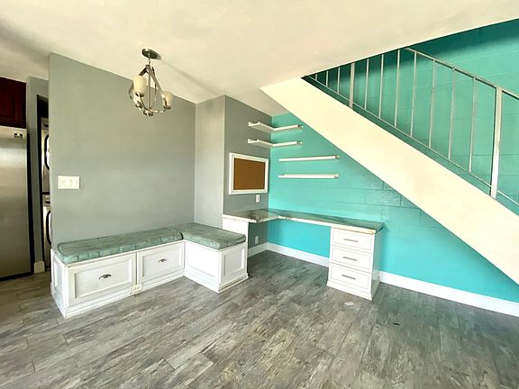 Breakfast nook with storage and built in office desk with floating shelves