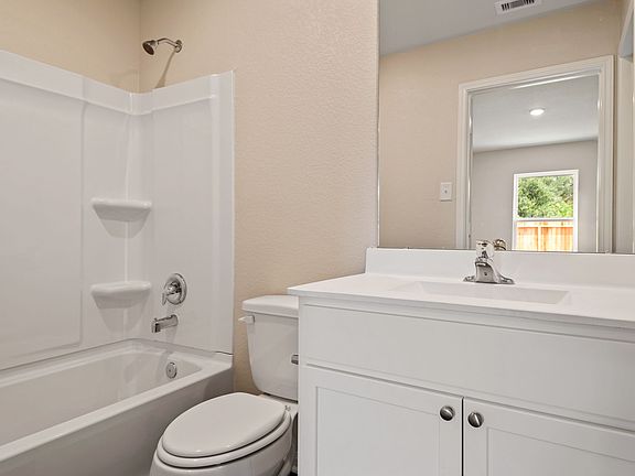 Master bathroom with a shower tub combination