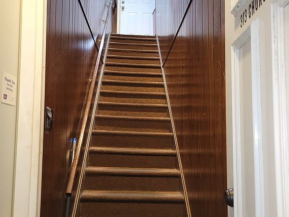 Enclosed staircase up to 313 Church Street Suite 1. This is a second floor apartment.