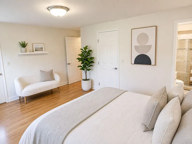 Master bedroom with in-suite bathroom, and door to balcony