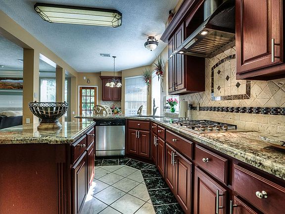 A cook made into a chef overnight! Spacious granite island overlooks the family room and breakfast a