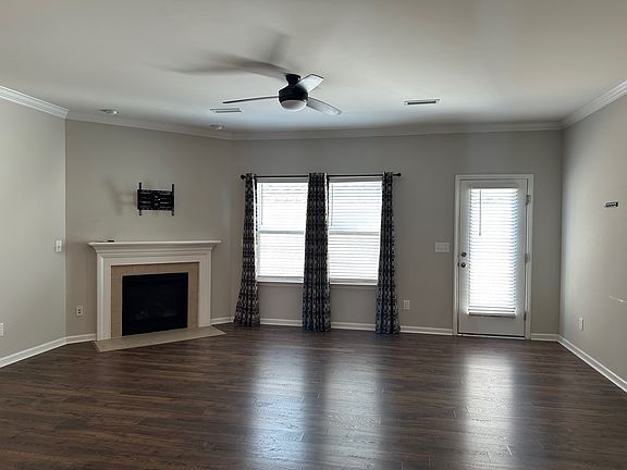Living room with gas fireplace and TV mount