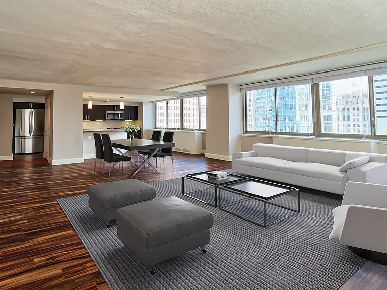 Large living area with wood flooring throughout