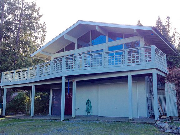 House Front View with Deck & Garage