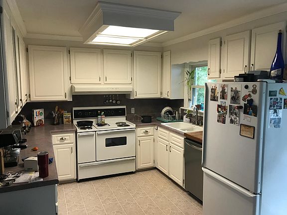 plenty of counter space and large stove/oven with side small oven. large wooden cutting table.