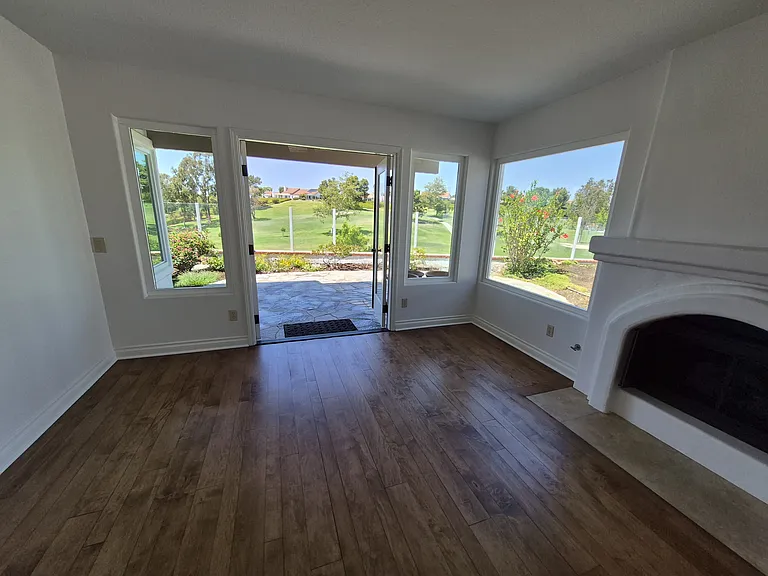 Double french door open to flagstone patio and more beautiful views.