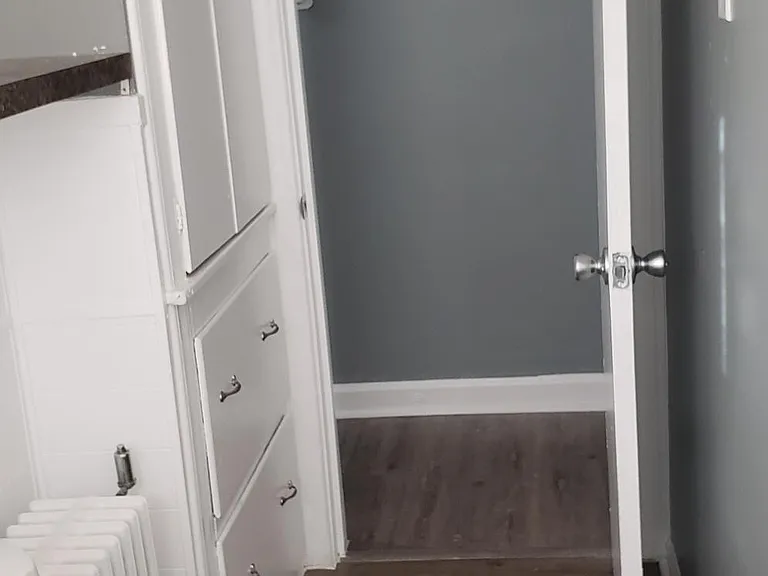 Bathroom with ample storage and linen closet.