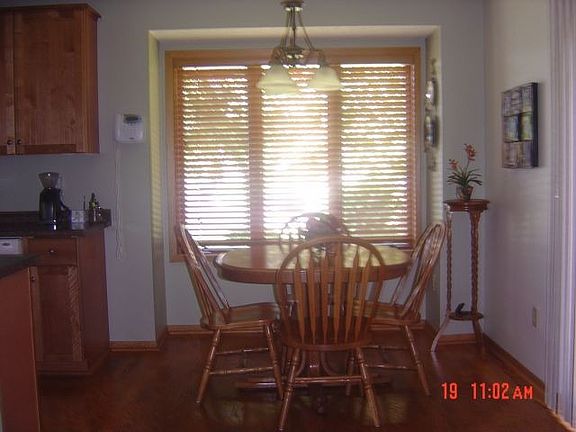Dinette w/Hardwood Floors & Access to Atrium Door Leading to Deck