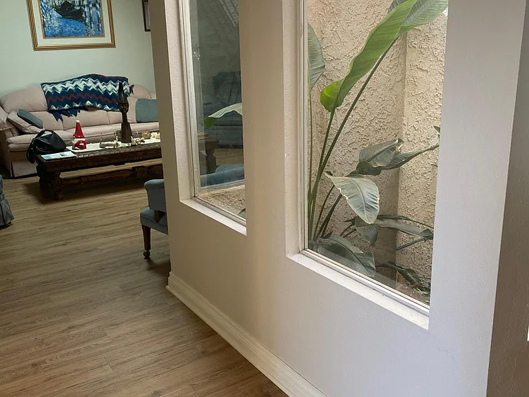 view into living room next to atrium