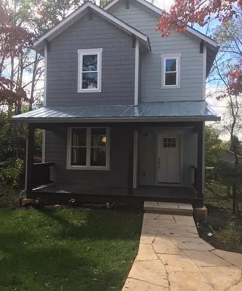 Front of house, standing in off street parking space