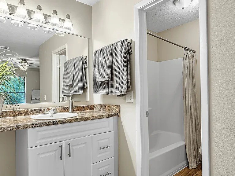 Rejoice in opulence within the master bathrooms featuring distinct vanity and shower spaces for a regal, spa-like retreat.